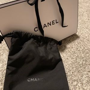 New Chanel box with a tie closure and also black Chanel drawstring soft pouch